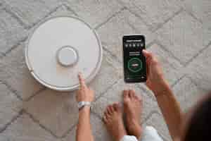 Free photo robotic wireless vacuum cleaner control by smartphone app