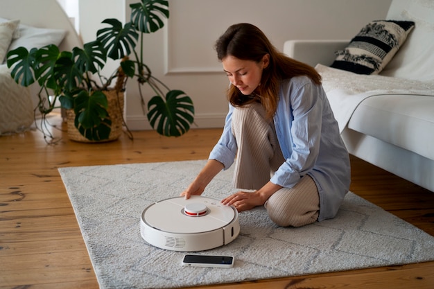 Free photo robotic wireless vacuum cleaner control by smartphone app