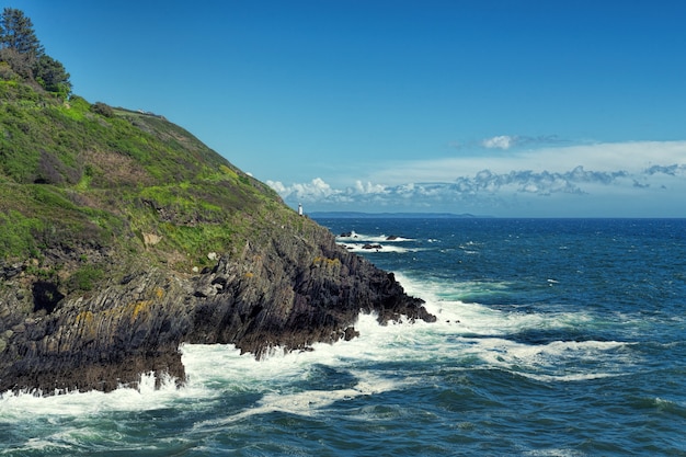 Rock formation beside blue sea