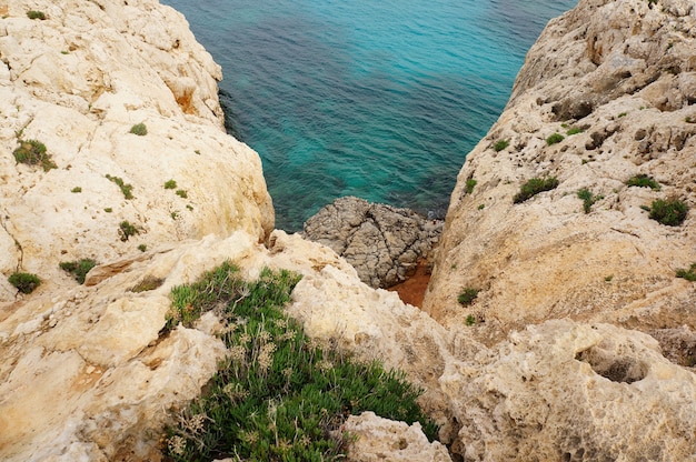 Rocks and a blue sea in Cyprus during daytime