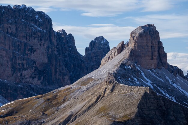 Rocks in the Italian Alps under the cloudy sky in the morning