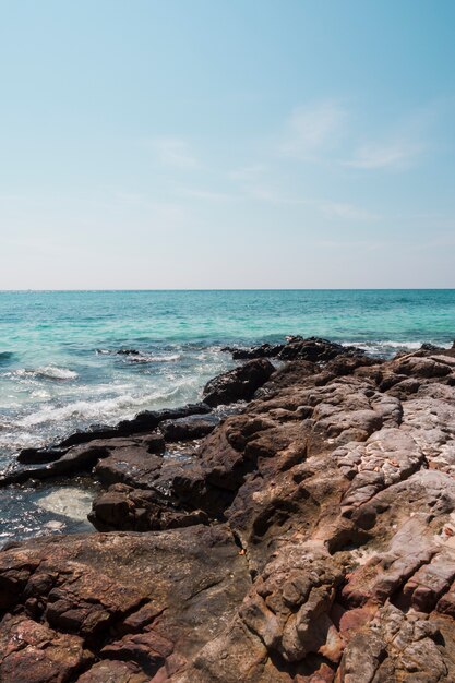 Rocky idyllic sea against blue sky