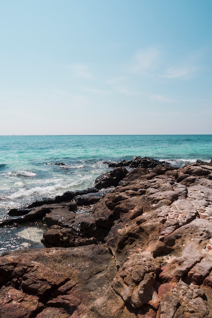 Rocky idyllic sea against blue sky