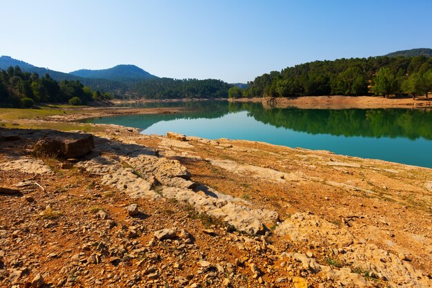 Rocky landscape with mountains lake