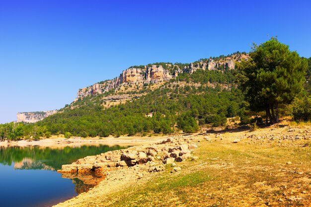 Rocky landscape with mountains reservoir