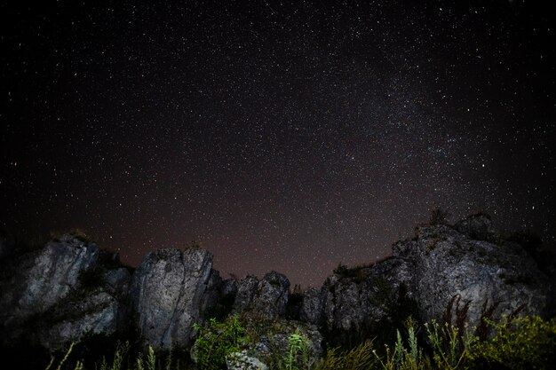 Rocky mountains and starry night sky