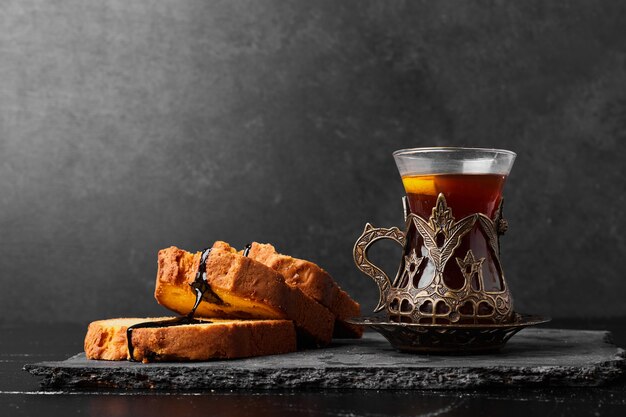 Roll cake slices with a glass of tea.