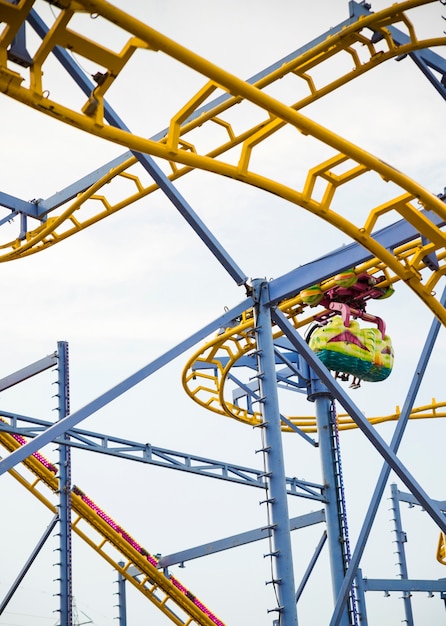 Free photo roller coaster ride against sky