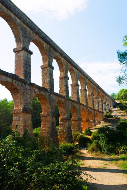 Roman aqueduct de les Ferreres in sunny day