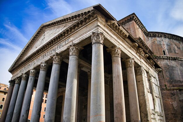 Roman Pantheon at daylight with vibrant blue sky Rome Italy