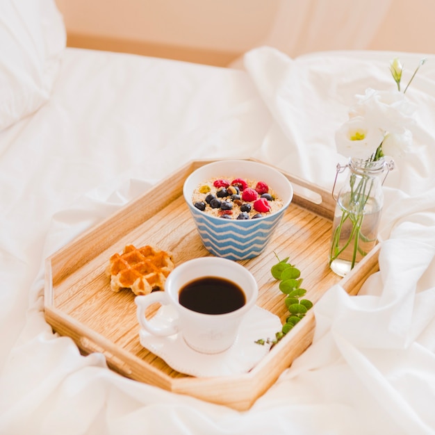 Romantic arrangement of breakfast on tray