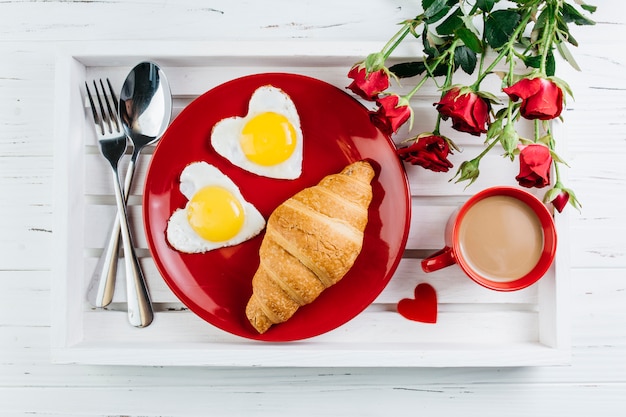 Romantic breakfast on wooden tray