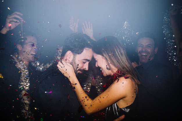 Free Photo romantic couple celebrating in club