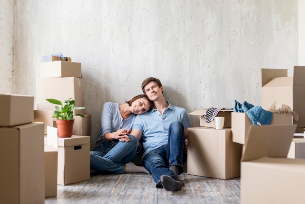 Romantic couple enjoying they home while packing to move out