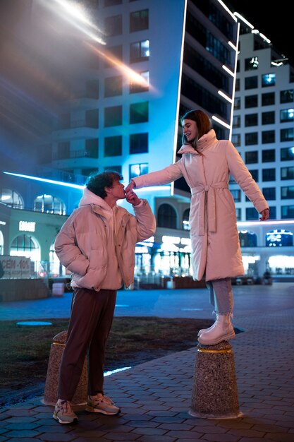 Romantic couple at night enjoying the city life