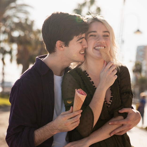 Romantic couple outdoors with ice cream