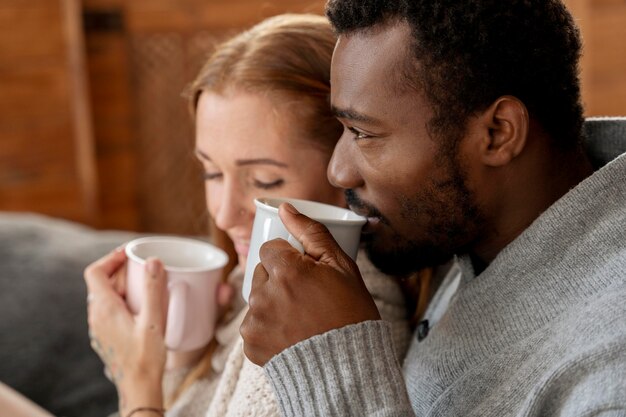 Romantic couple with cups close up