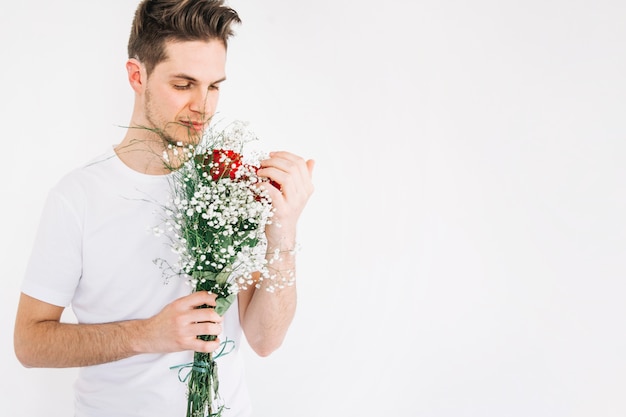 Romantic man with blooming bouquet