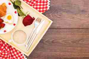 Free photo romantic meal on tray with red rose