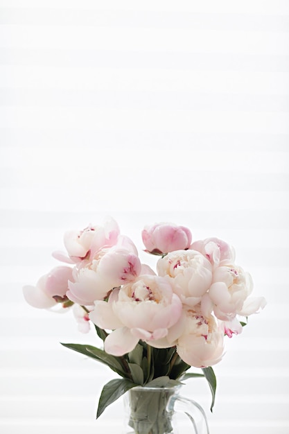 Free Photo romantic peonies on a light background feminine bouquet for a wedding or birthday