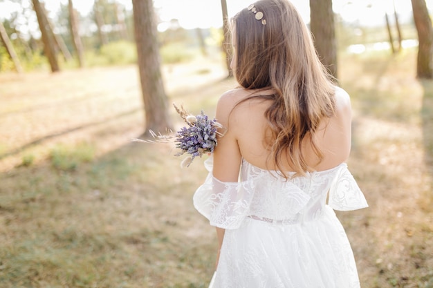 Free photo romantic photo in the fairy forest. beautiful woman