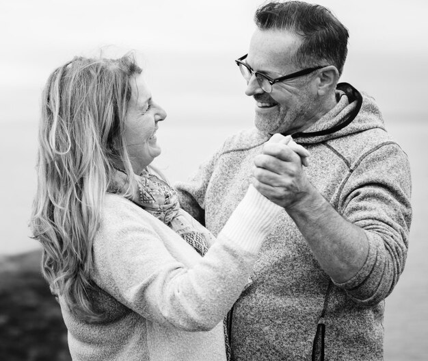 Romantic senior couple dancing outdoors