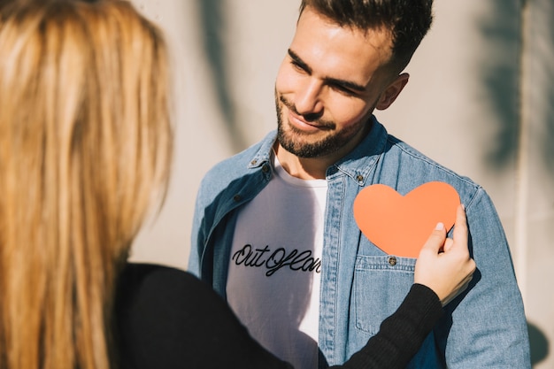 Free Photo romantic woman and man with red heart