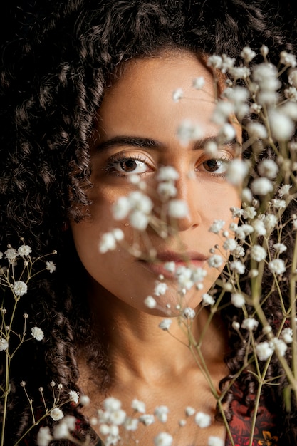 Romantic woman with flower twigs 