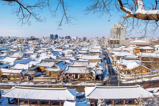 Roof of Jeonju traditional Korean village covered with snow, Jeonju Hanok village in winter, South Korea