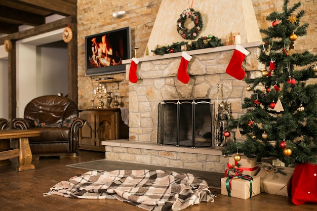 Room with christmas tree and fire place