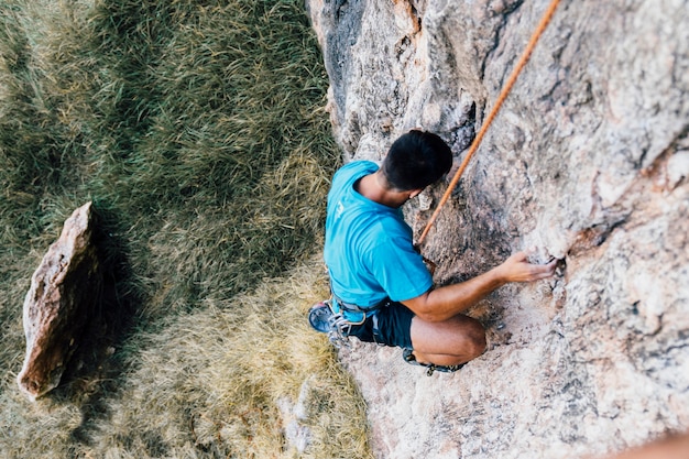 Rope climber on rock