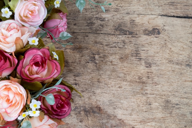 Free Photo rose flowers on rustic wooden background. copy space.