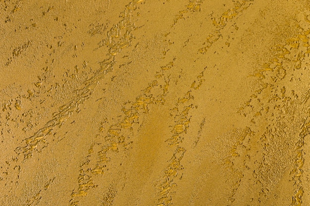 Free photo rough yellow concrete wall surface