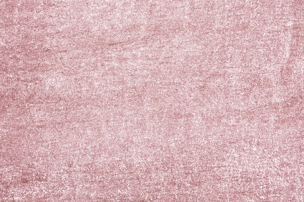 Roughly pink gold painted concrete wall surface background