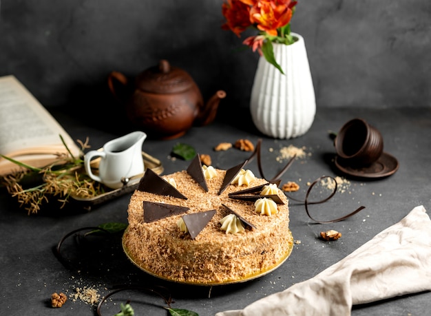 Free Photo round cake covered with crumbles topped with chocolate pieces