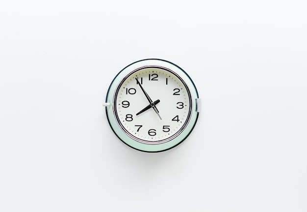 Free photo round clock watch on white background