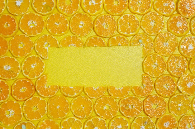 Free Photo round orange slices fruit copy space