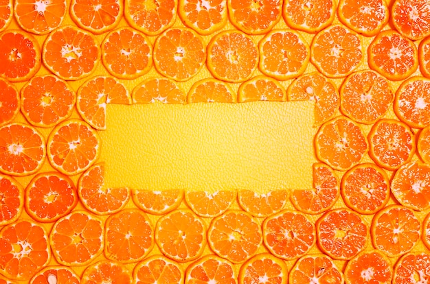 Free photo round orange slices fruit copy space