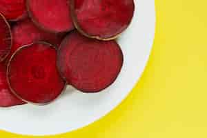 Free photo round textured slices of beetroot on a plate