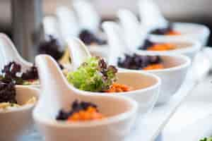 Free photo row of bowls with salad