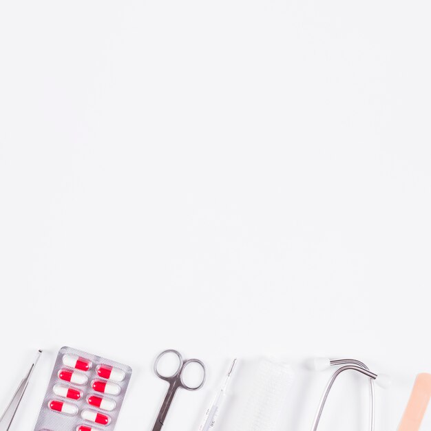 Row of medical equipments on white background