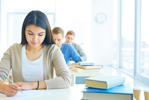 Row of students doing an exam