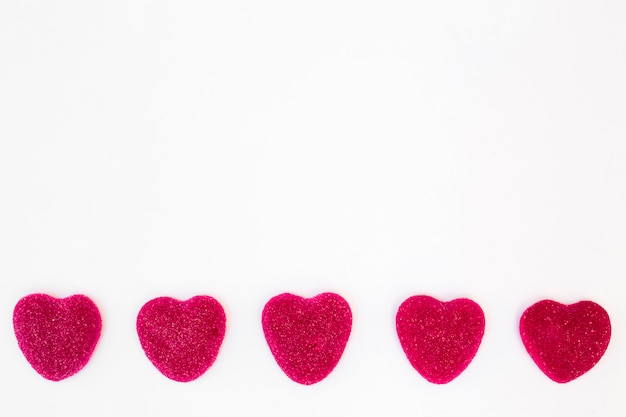 Free photo row of sweet candies in form of hearts