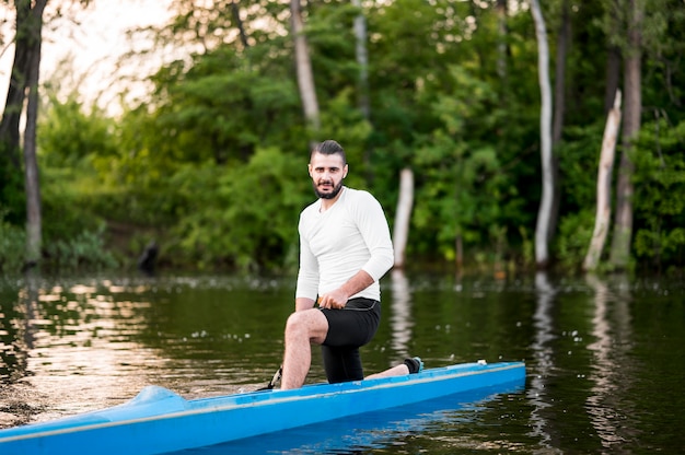 Rowing concept with man in kayak