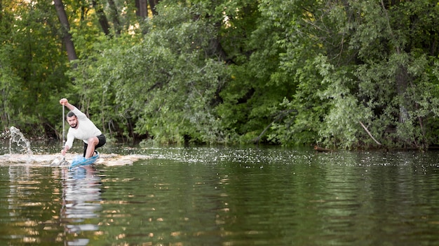 Free photo rowing concept with young man