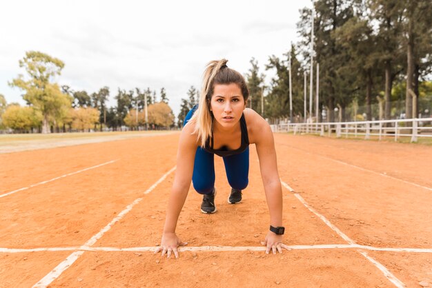 Runner woman in starting position