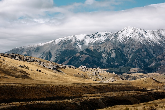 Rural scene in the South Island of New Zealand sounded by mountains covered with snow