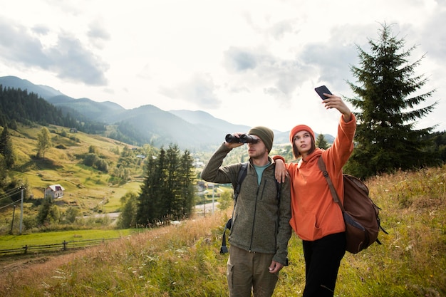 Free photo rural travelers exploring the surroundings together