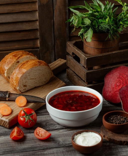 Russian soup borshch in white bowl