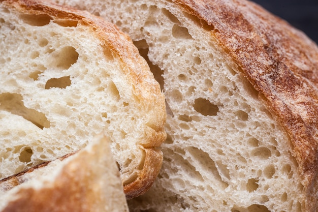 Rustic bread on wood table. Dark wooden